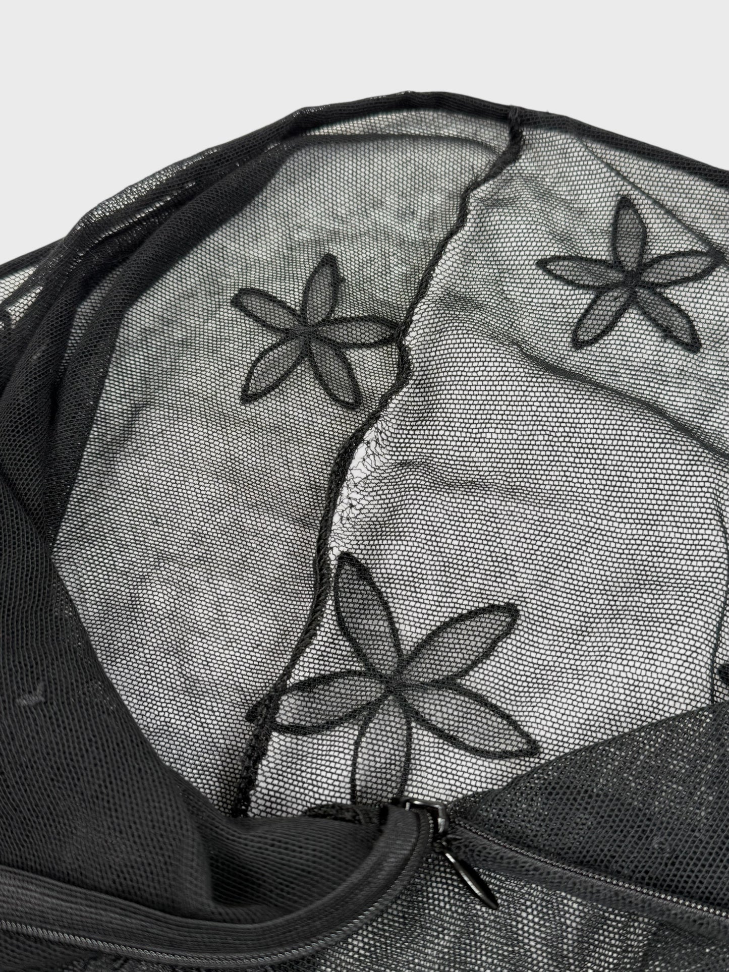 D&G by Dolce & Gabbana late-1990s black double mesh skirt with three-dimensional floral appliqués.