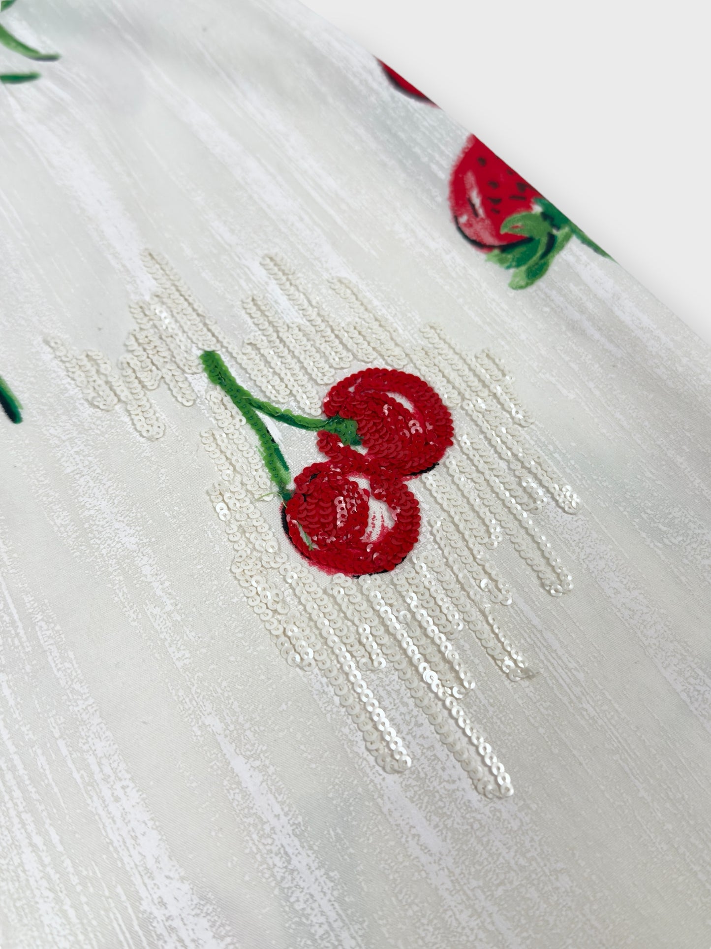 Blumarine early 2000s strawberry and cherry print skirt with sequin embellishment.