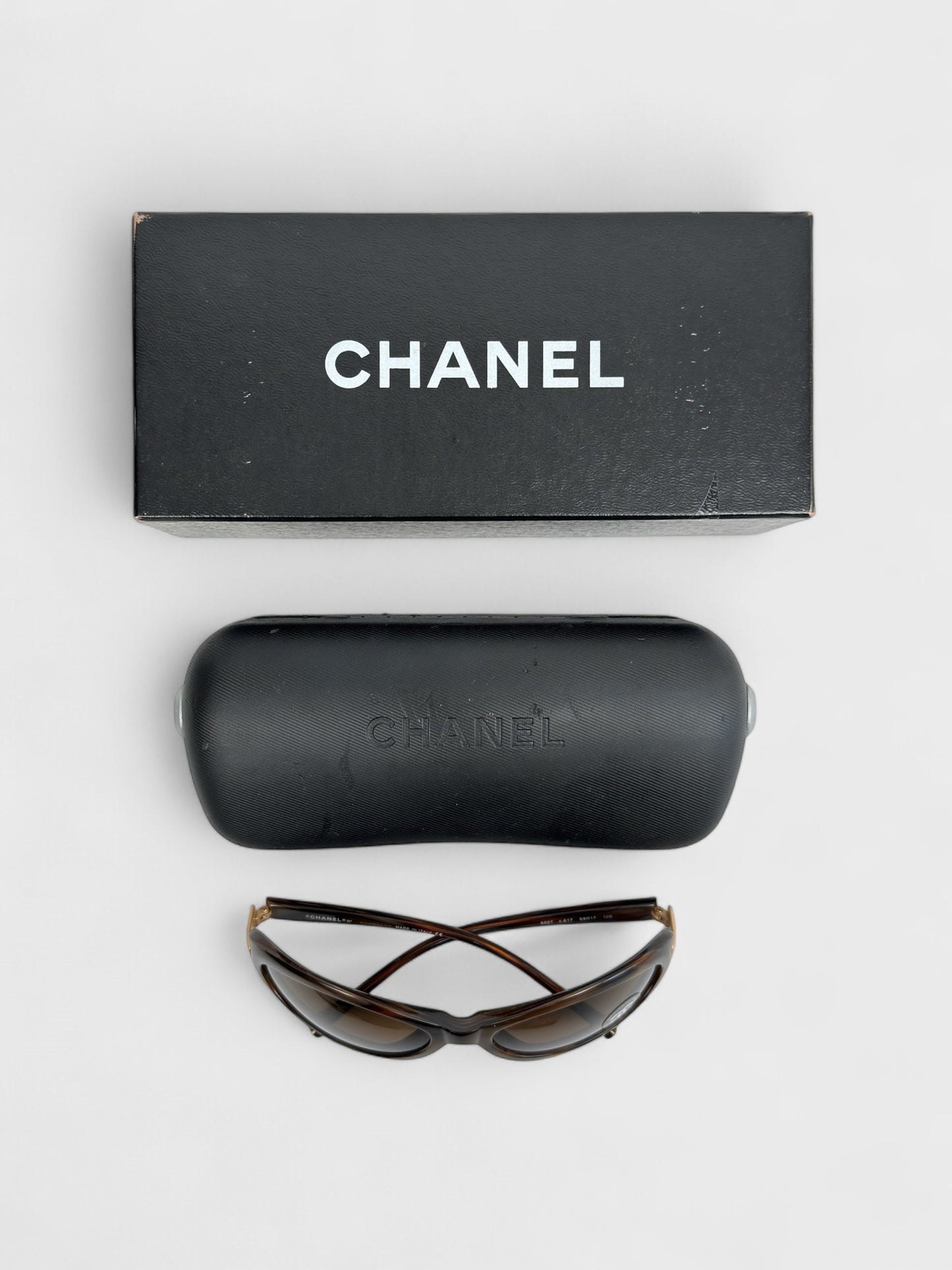 Chanel vintage 5027 sunglasses with oval frame and gold-tone details.