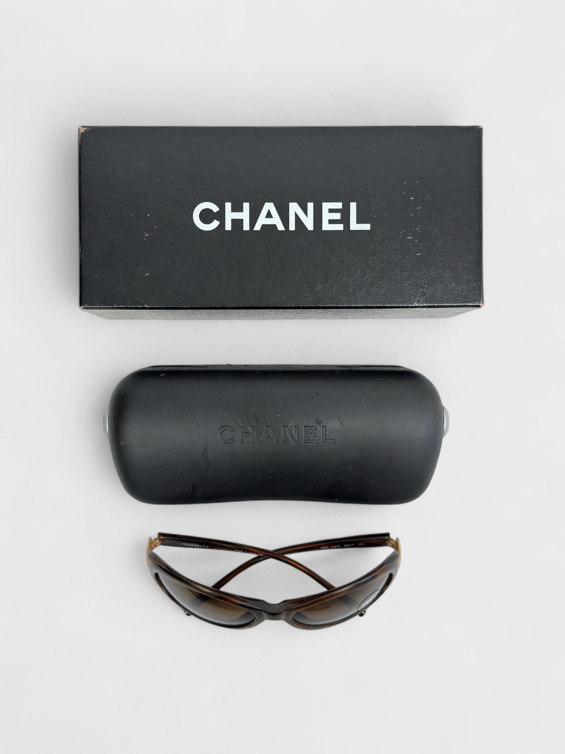 Chanel vintage 5027 sunglasses with oval frame and gold-tone details.