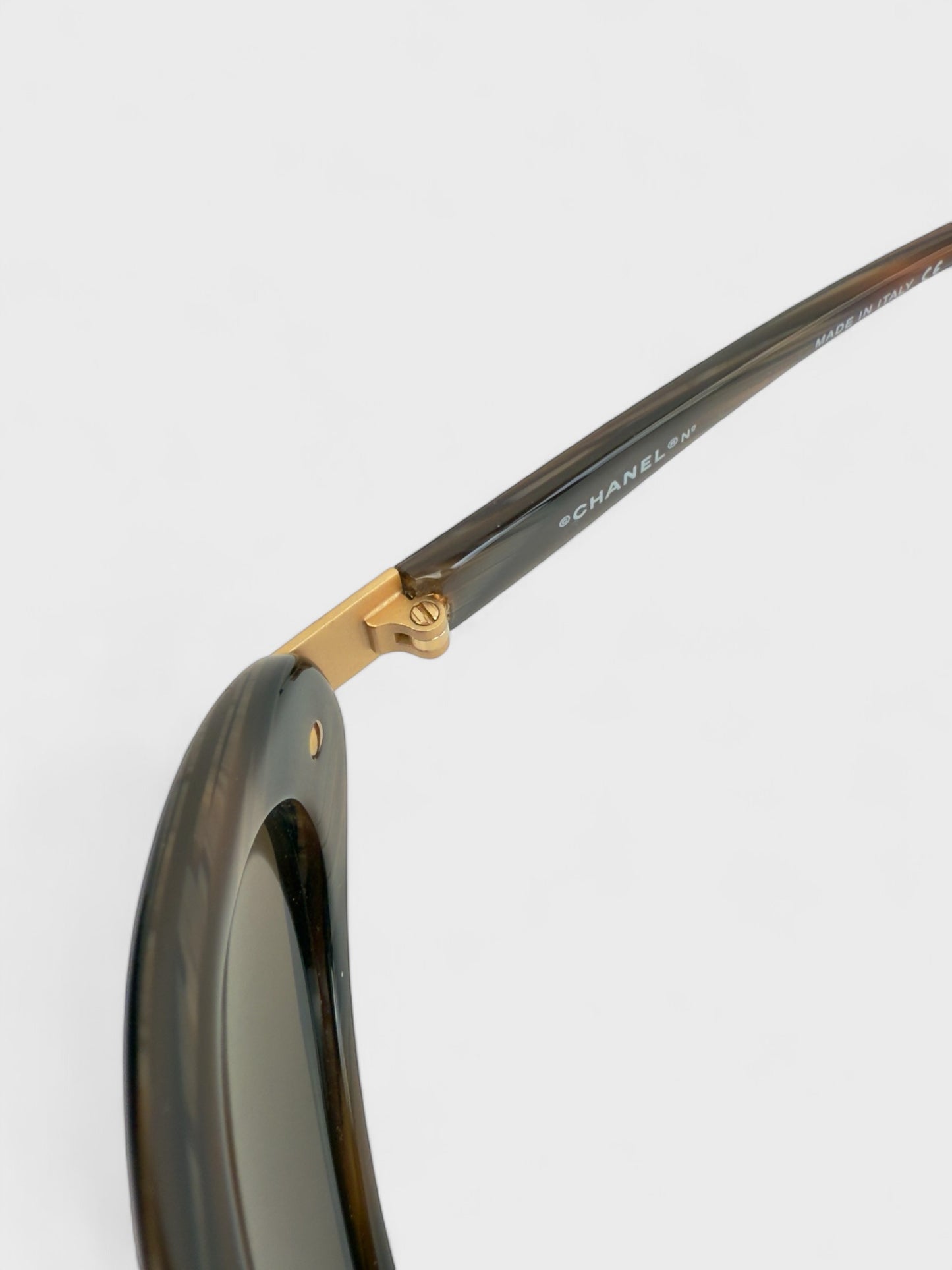 Chanel vintage 5027 sunglasses with oval frame and gold-tone details.