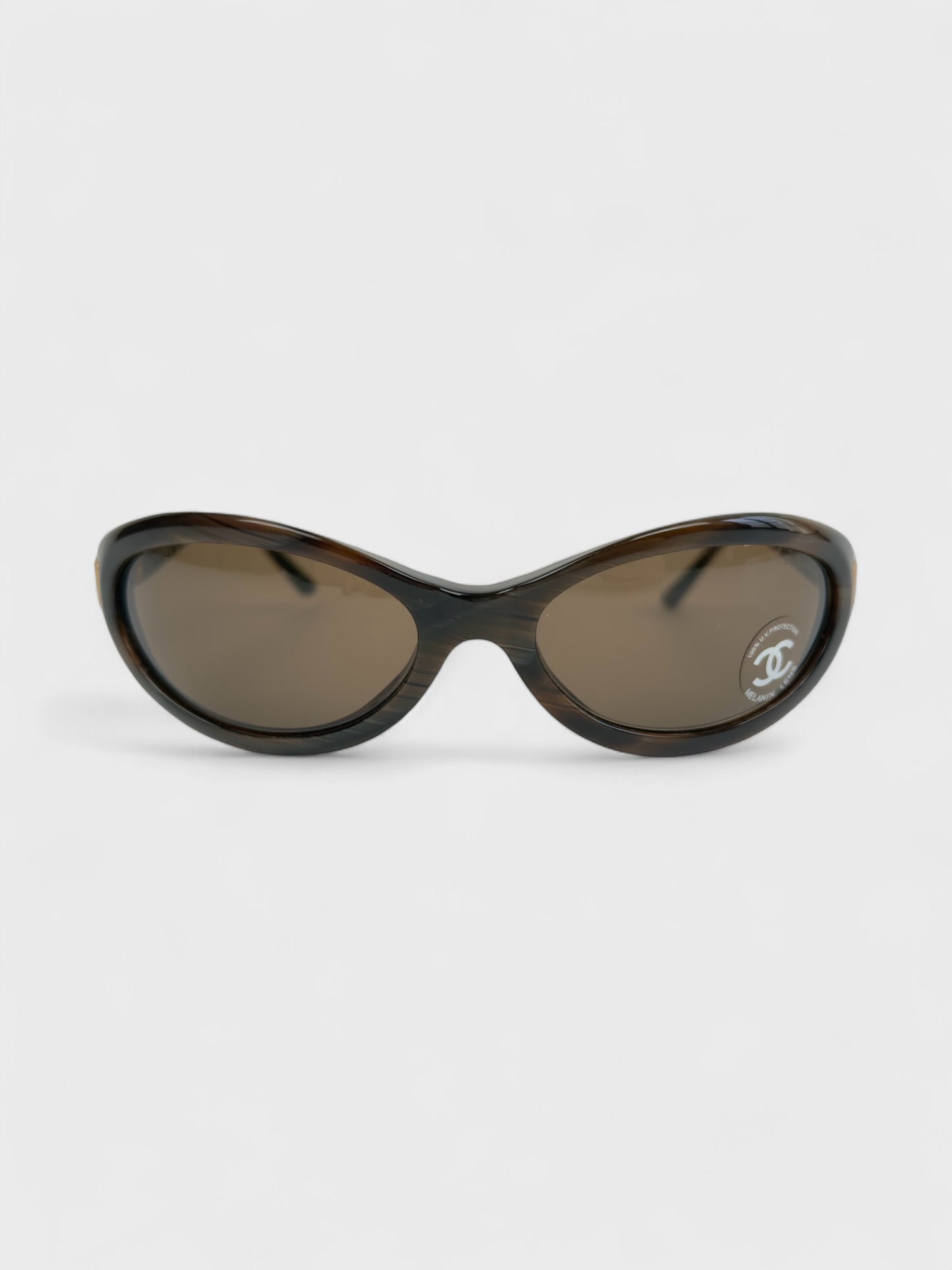 Chanel vintage 5027 sunglasses with oval frame and gold-tone details.