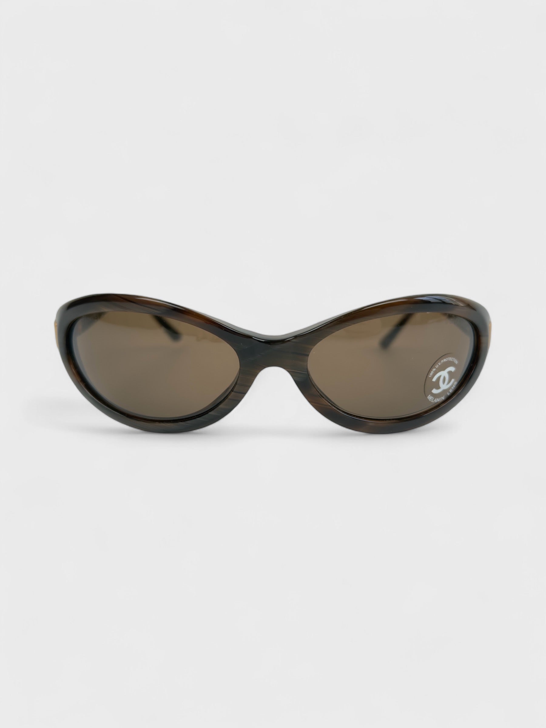 Chanel vintage 5027 sunglasses with oval frame and gold-tone details.