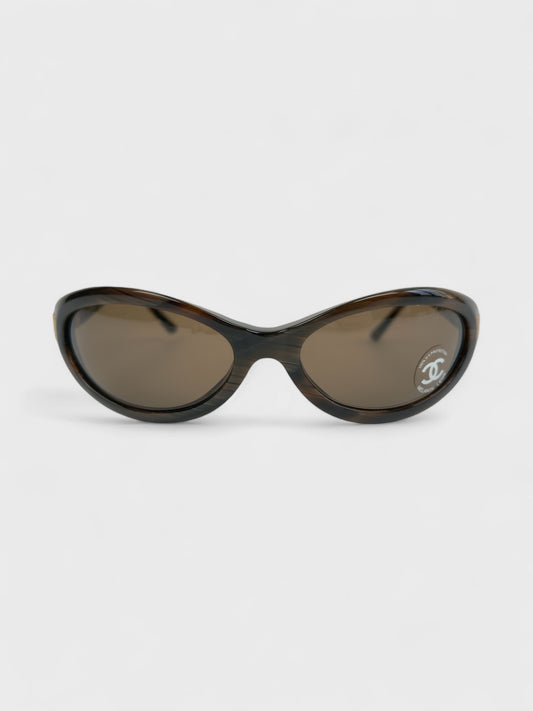 Chanel vintage 5027 sunglasses with oval frame and gold-tone details.