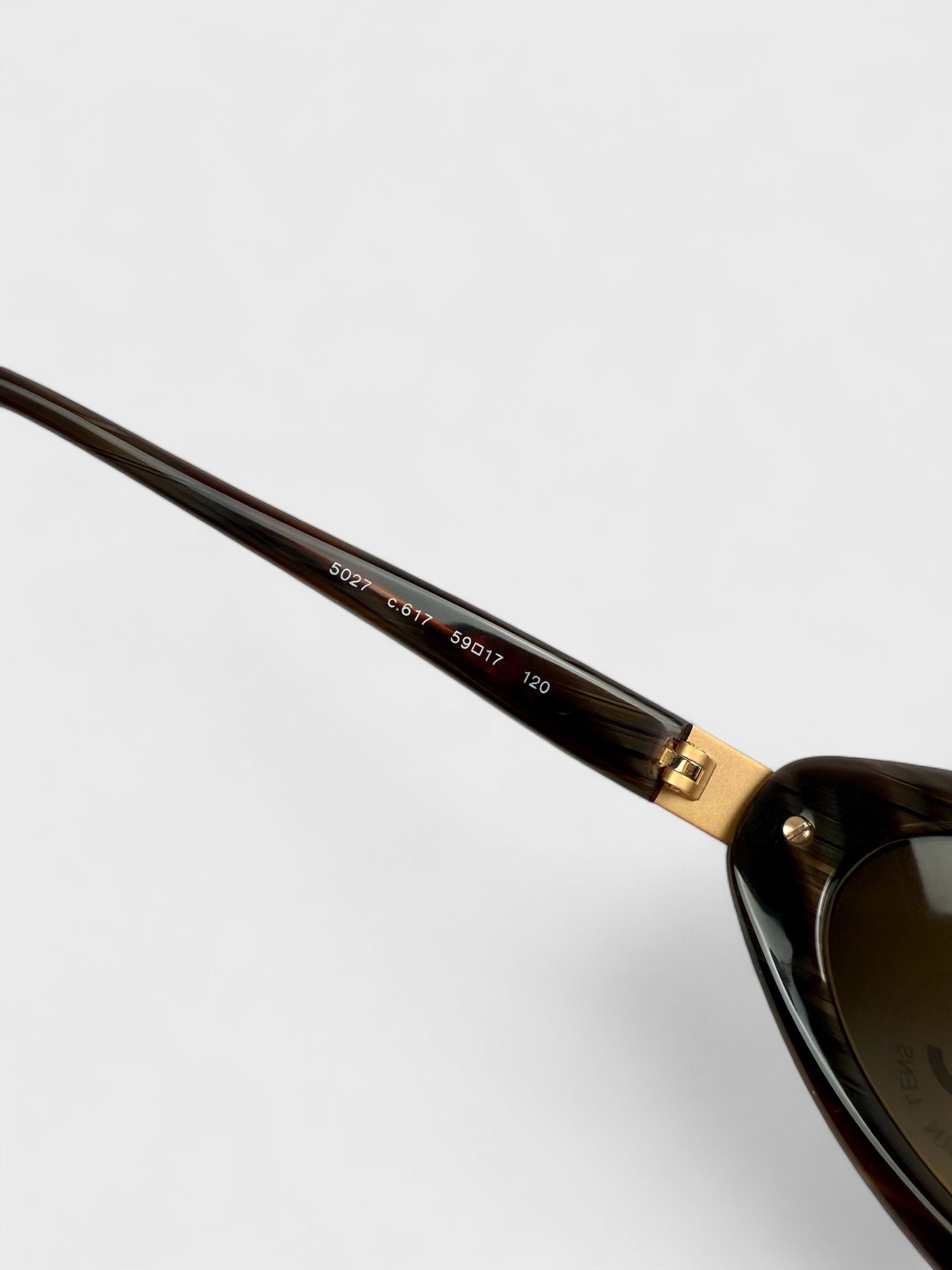 Chanel vintage 5027 sunglasses with oval frame and gold-tone details.