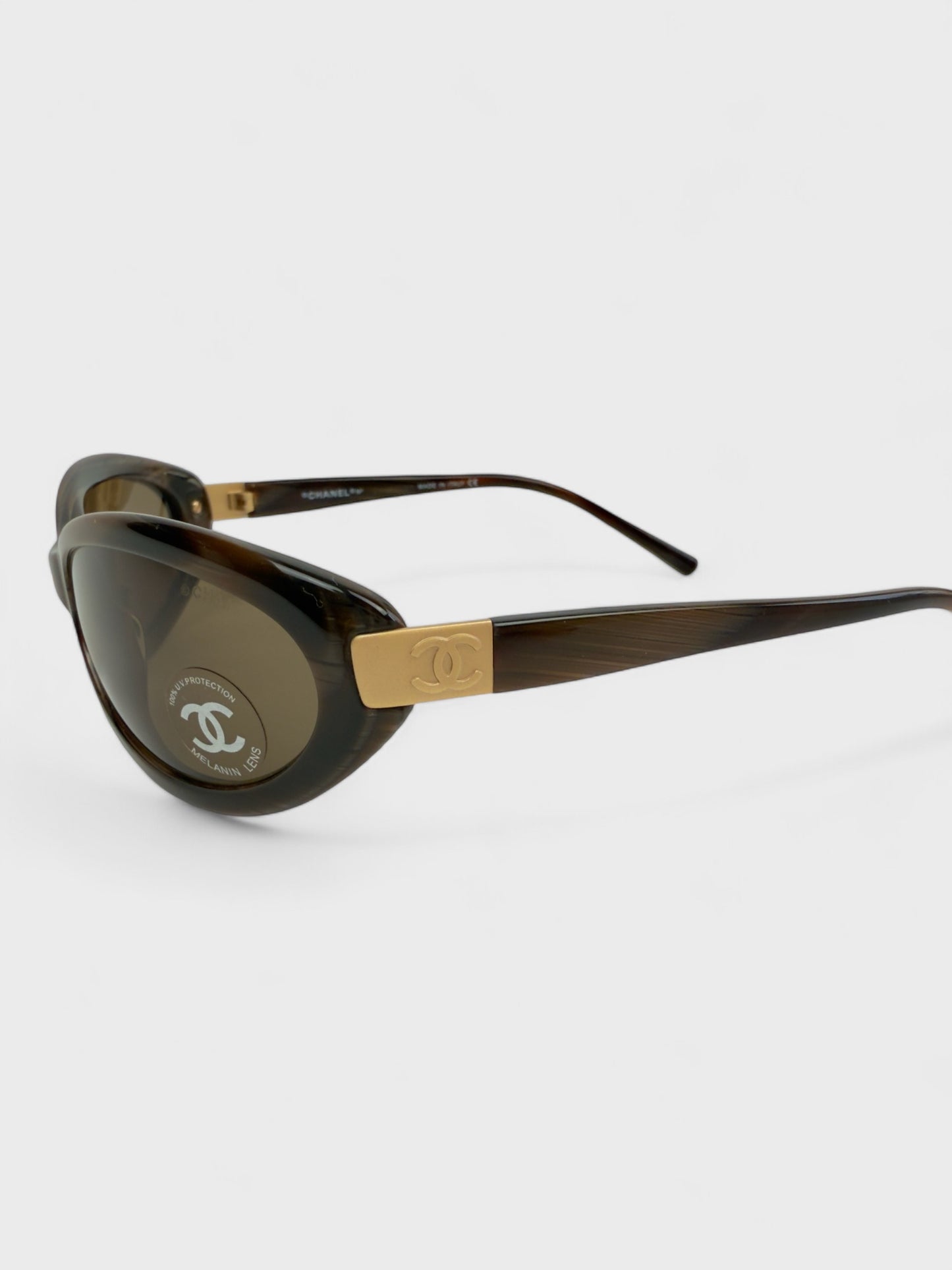 Chanel vintage 5027 sunglasses with oval frame and gold-tone details.