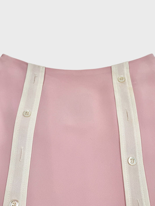 Cheap And Chic by Moschino 1990s pastel pink mini skirt with button decoration.