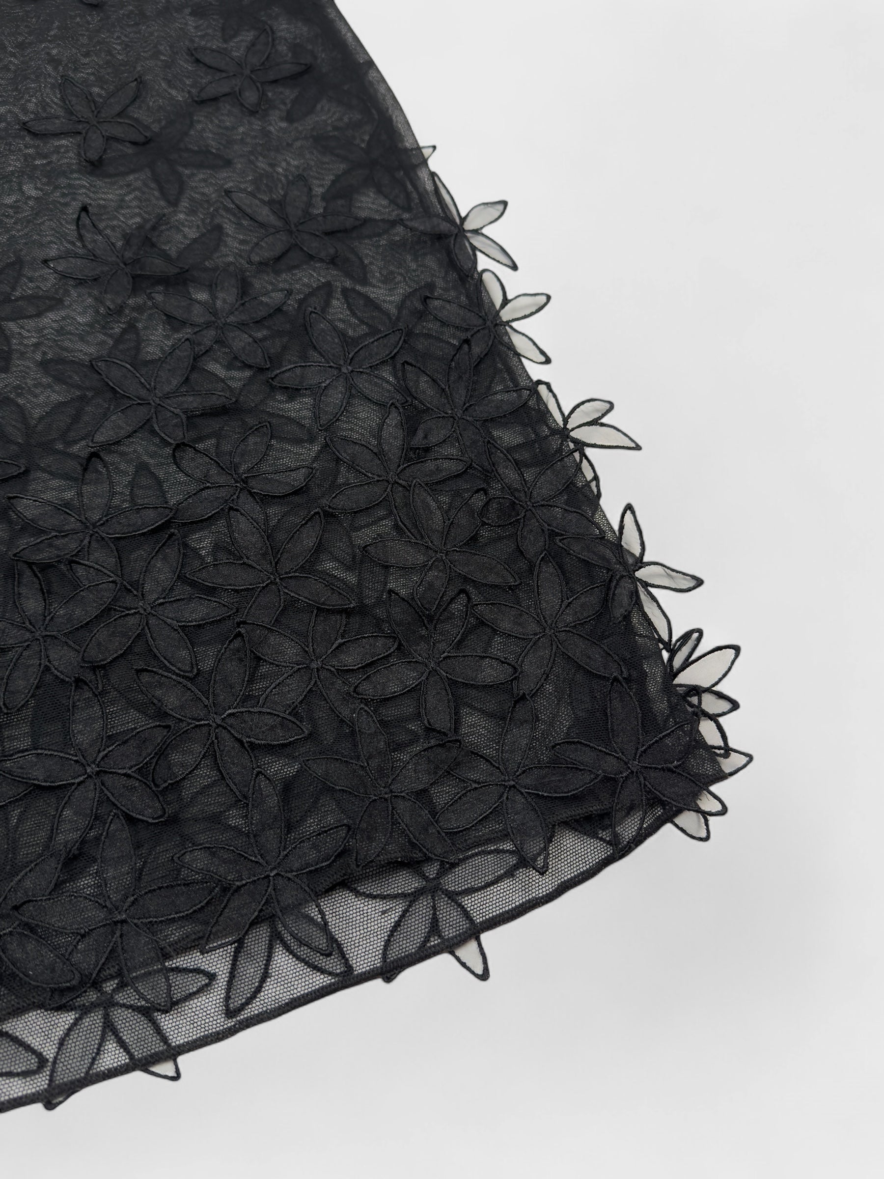 D&G by Dolce & Gabbana late-1990s black double mesh skirt with 3D floral appliqués.