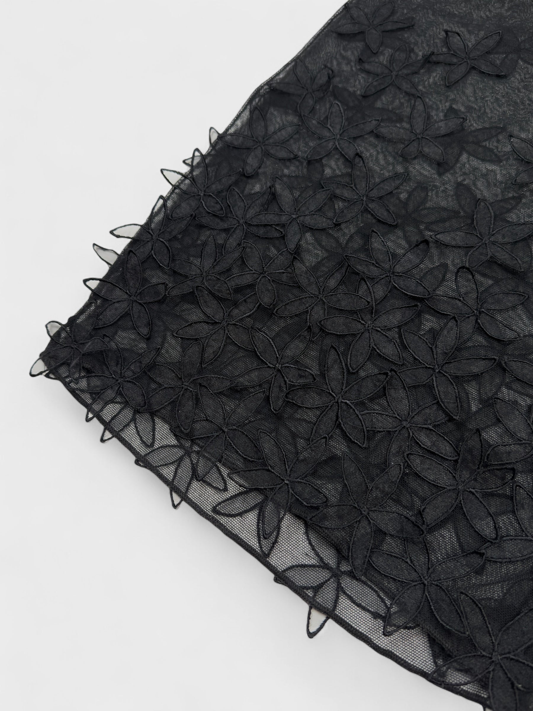 D&G by Dolce & Gabbana late-1990s black double mesh skirt with three-dimensional floral appliqués.