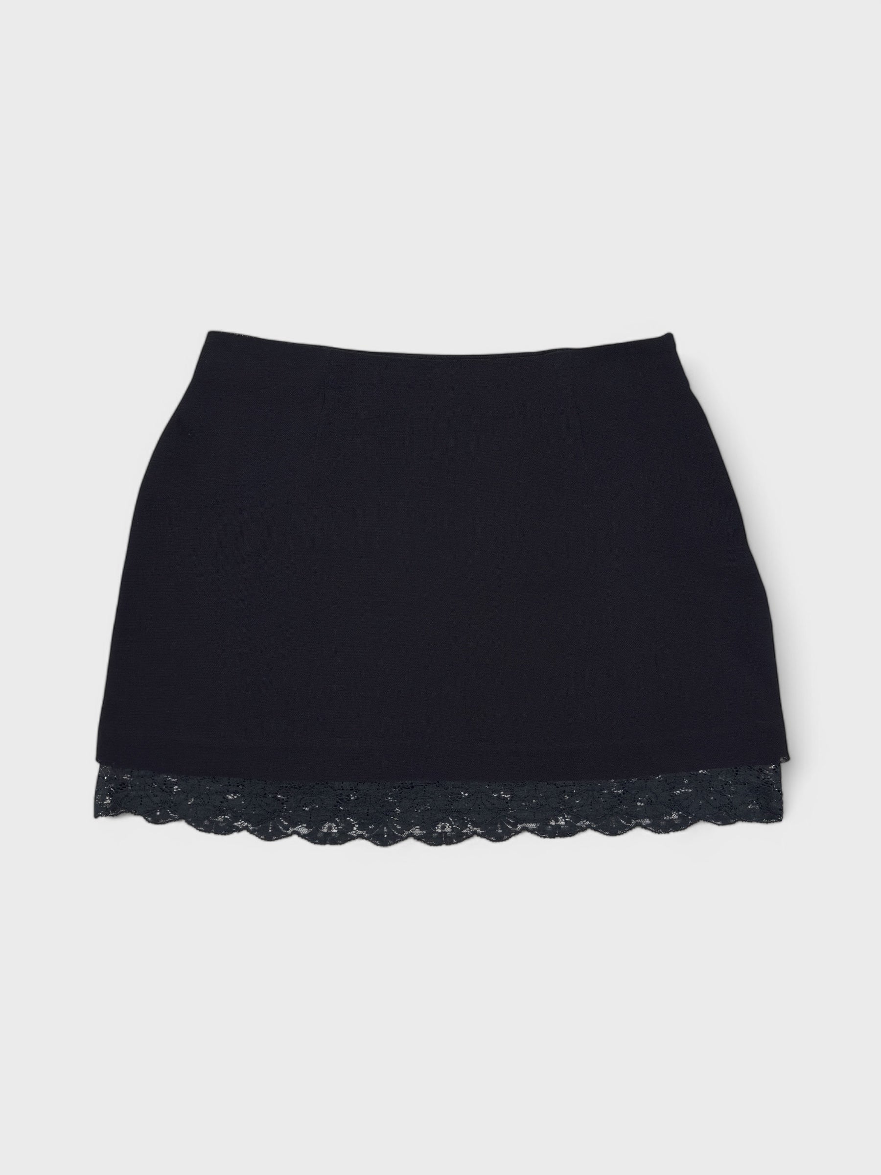 Dolce & Gabbana early 1990s black lace mini skirt with exposed trim.