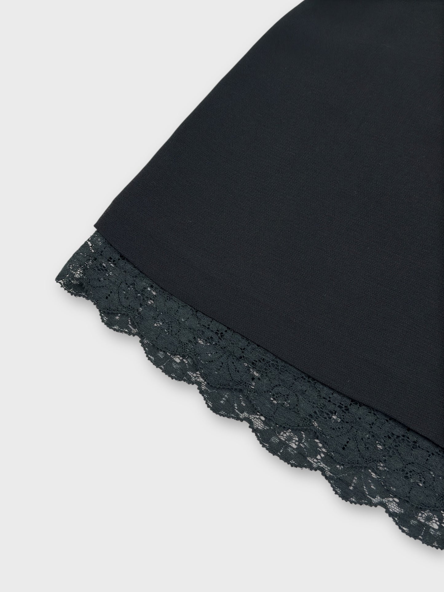 Dolce & Gabbana early 1990s black lace mini skirt with exposed trim.