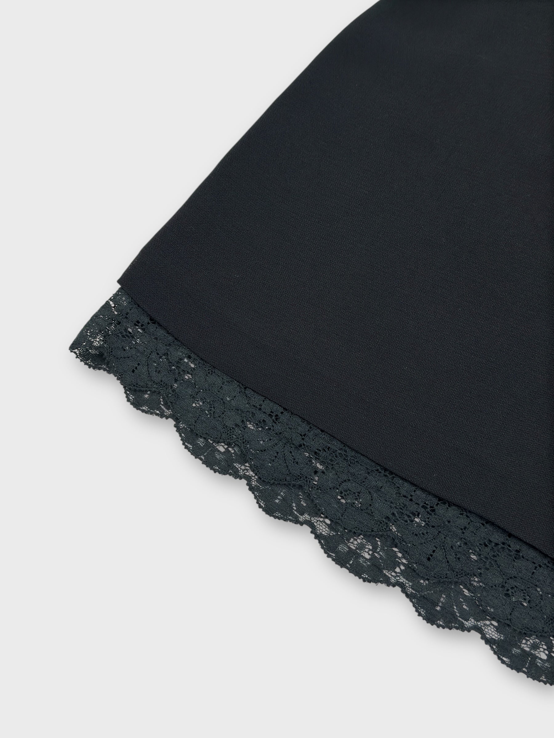 Dolce & Gabbana early 1990s black lace mini skirt with exposed trim.
