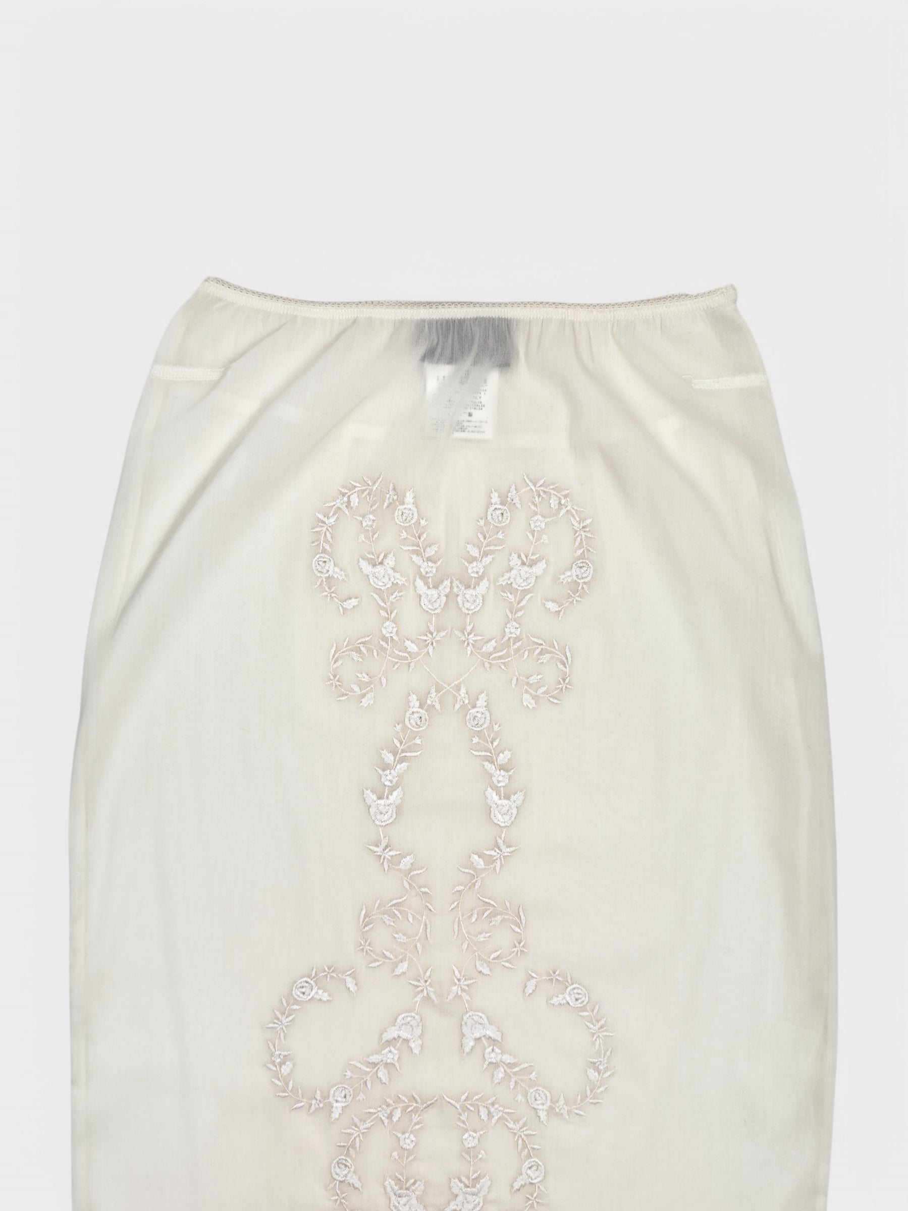 Dolce & Gabbana SS 1999 embroidered ivory pencil skirt with lace detailing and semi-transparent fabric.