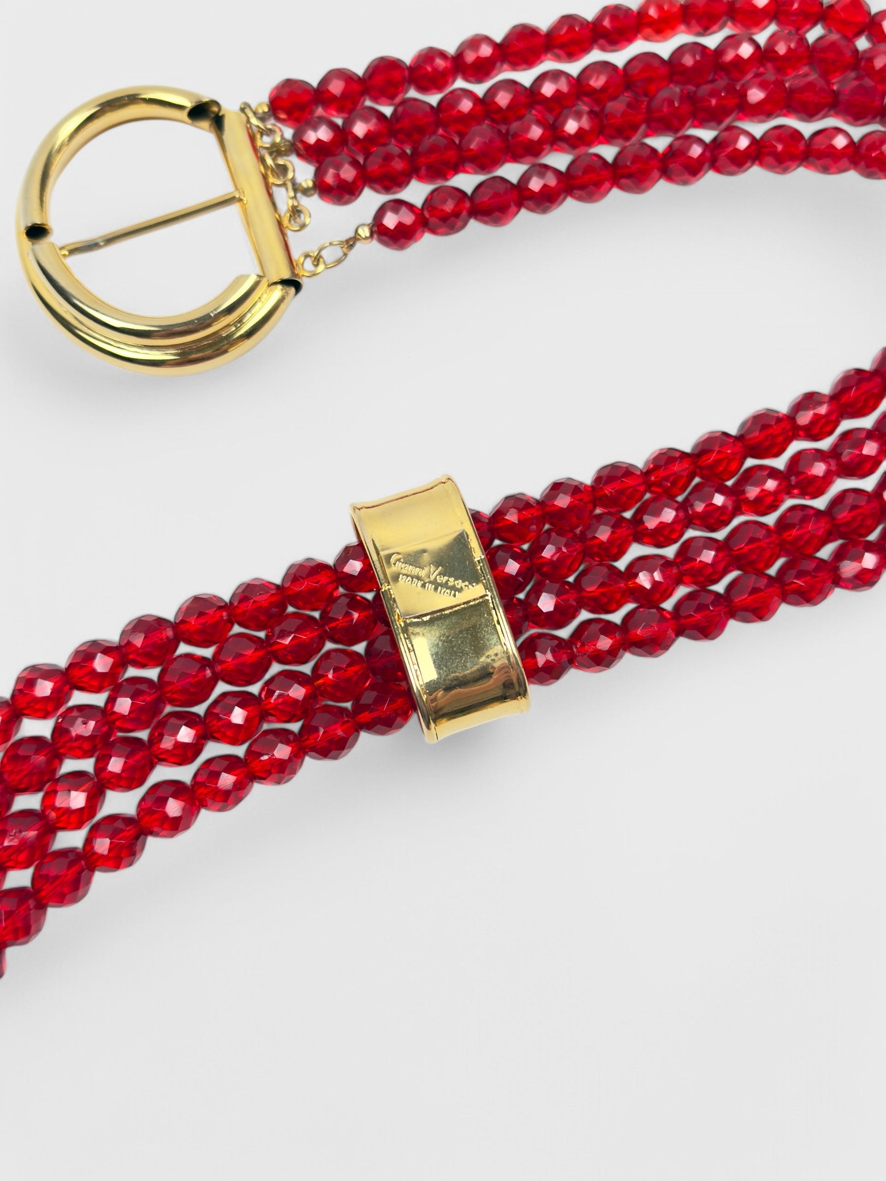 Gianni Versace 1980s beaded belt with red faceted beads and metal buckle.