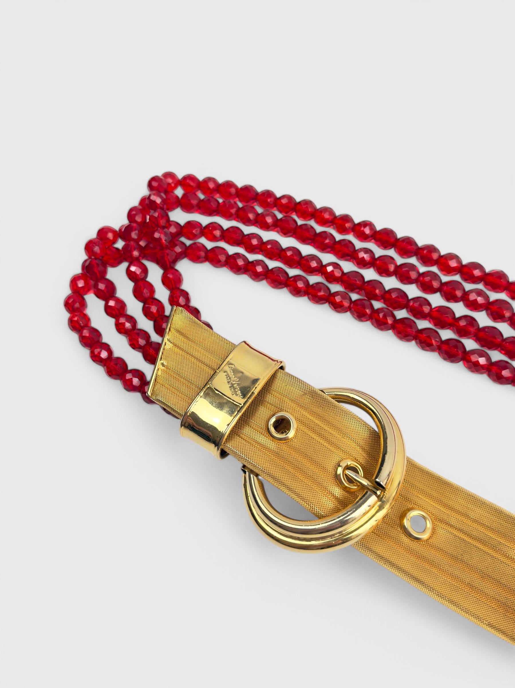 Gianni Versace 1980s beaded belt with red faceted beads and metal buckle.