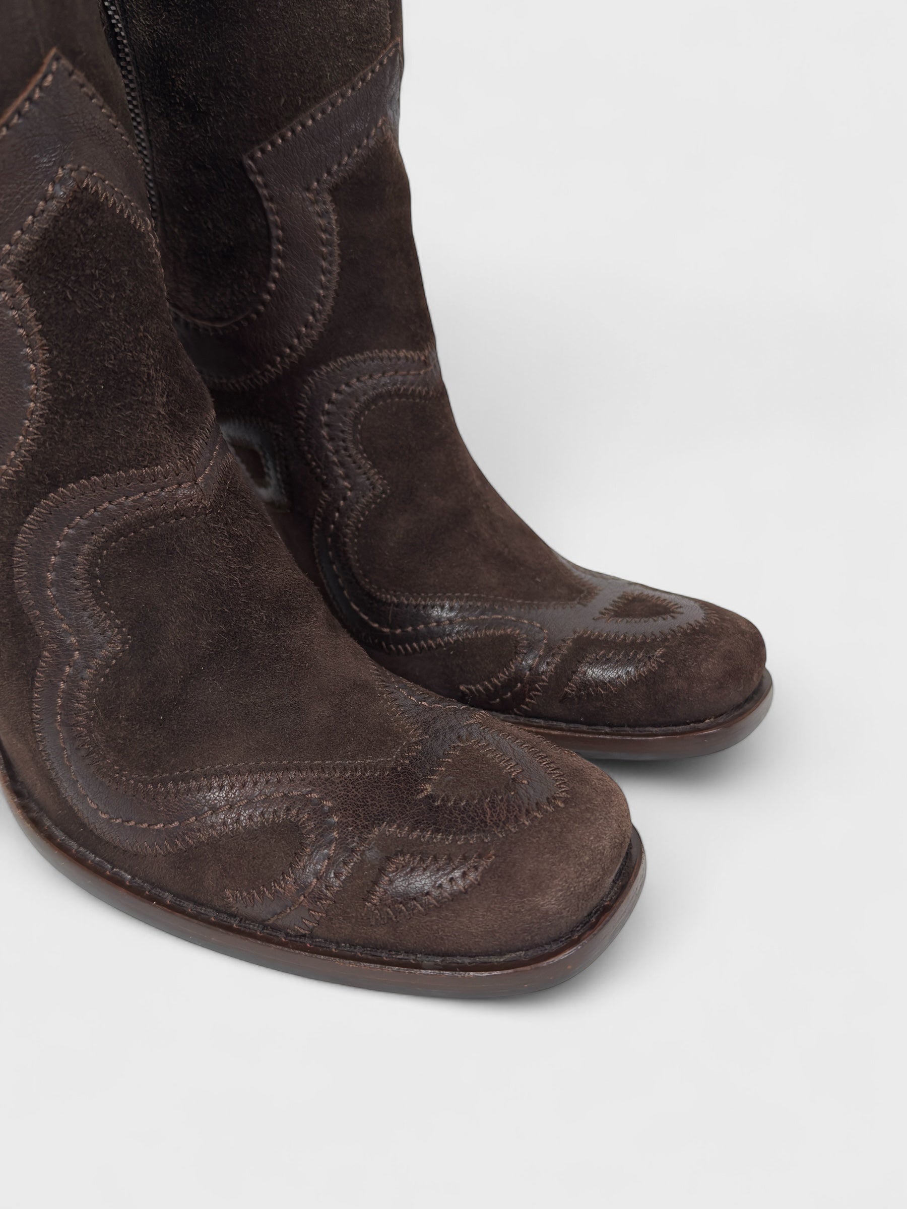 Vintage Miu Miu 2000s–2010s brown suede camperos boots with embroidered detailing and high heel.