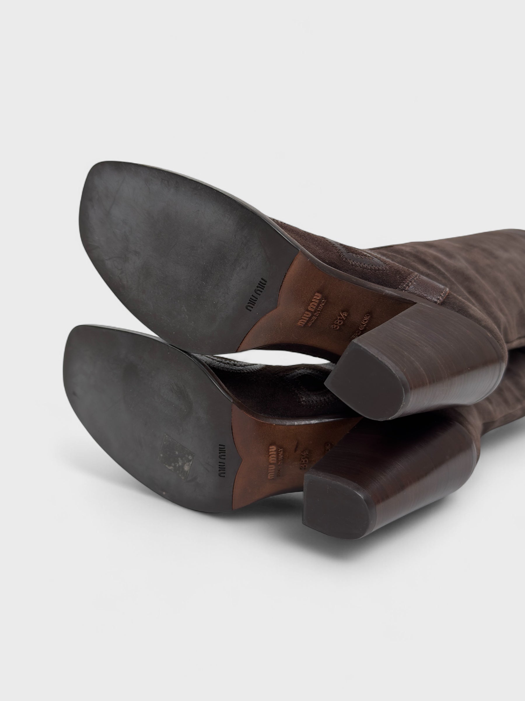 Vintage Miu Miu 2000s–2010s brown suede camperos boots with embroidered detailing and high heel.