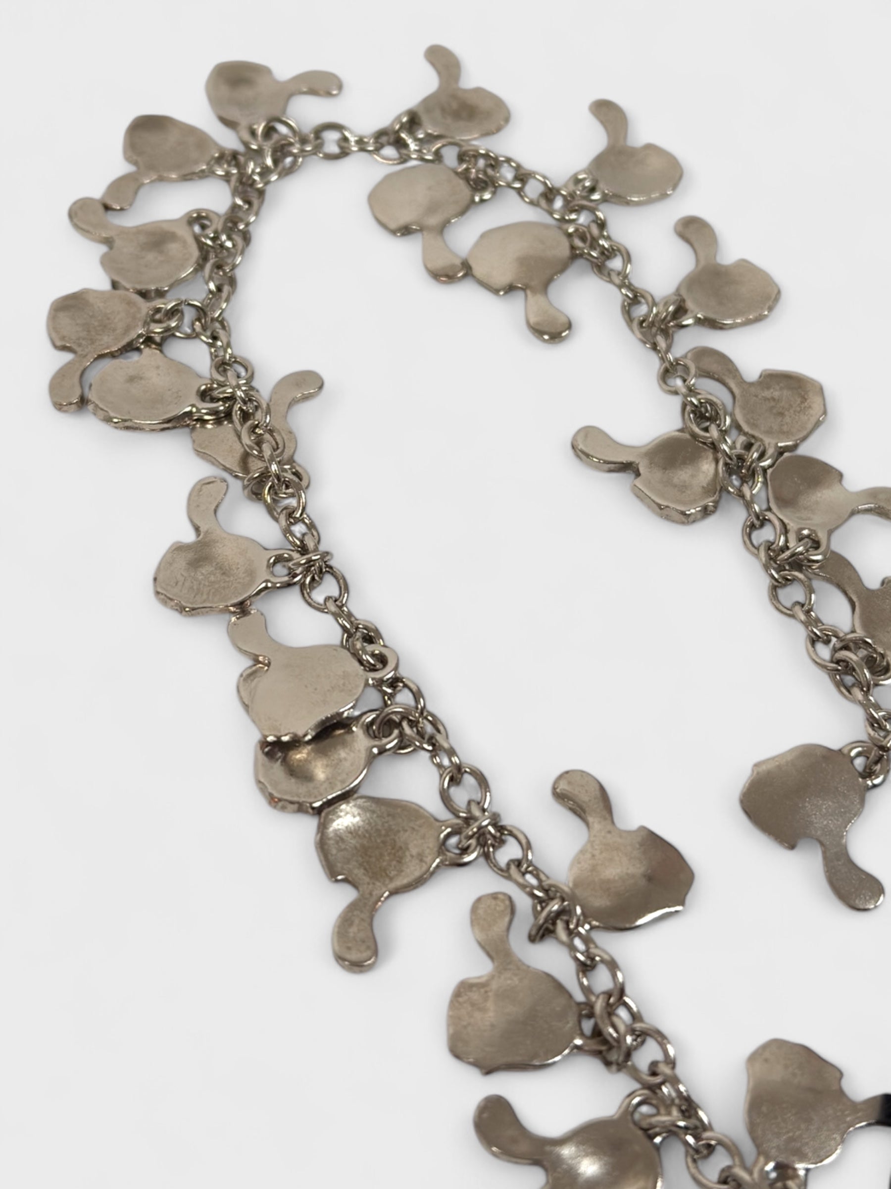 Moschino Cheap And Chic 1990s black mini dress with metallic charm shoulder straps.