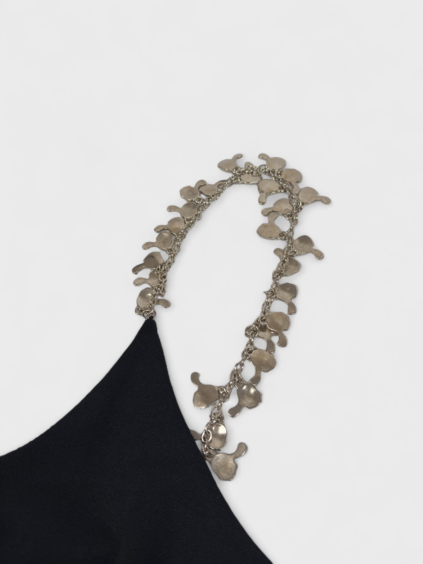 Moschino Cheap And Chic 1990s black mini dress with metallic charm shoulder straps.