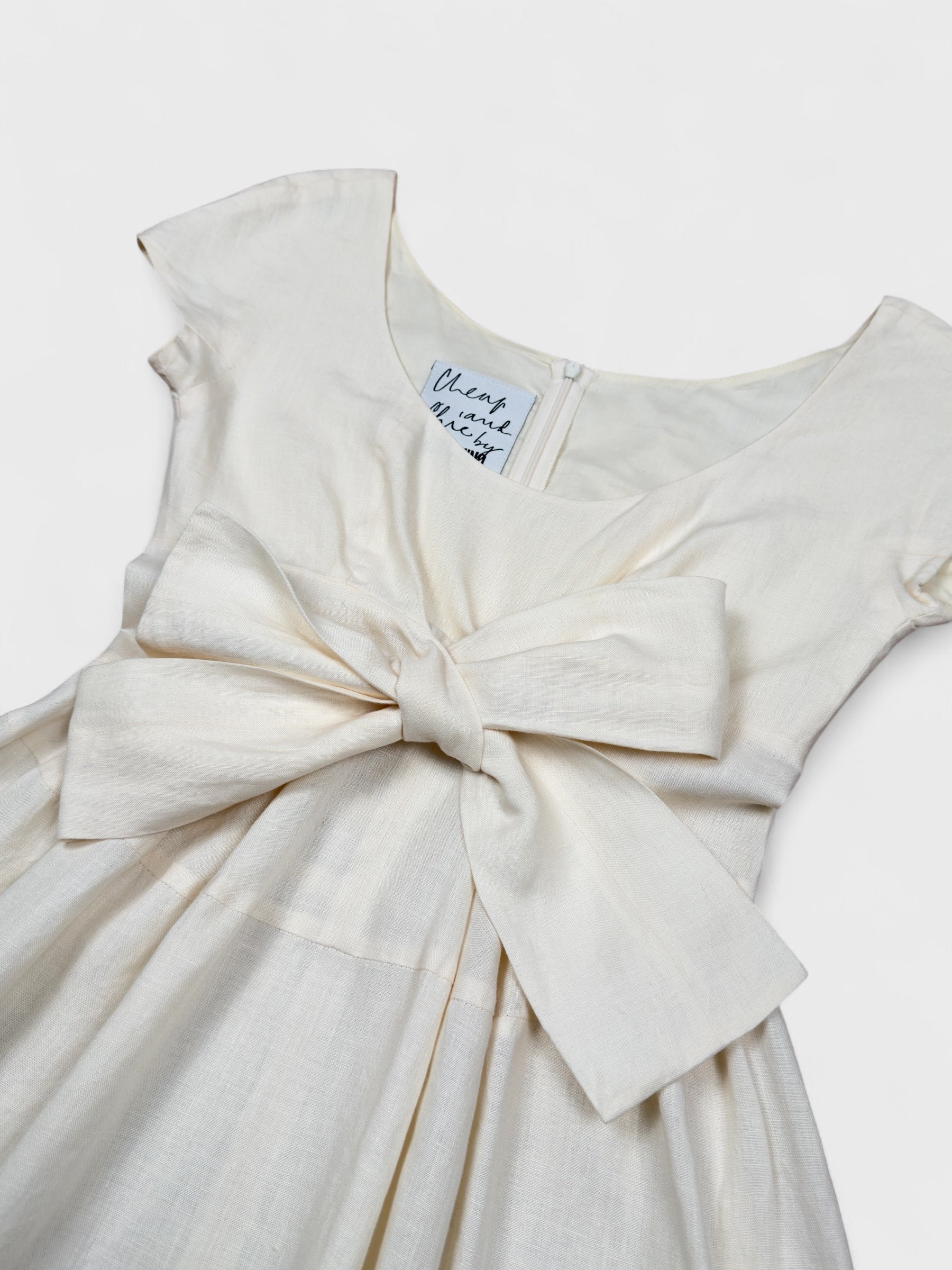 Moschino Cheap And Chic 1990s linen bow dress with front ribbon detail.