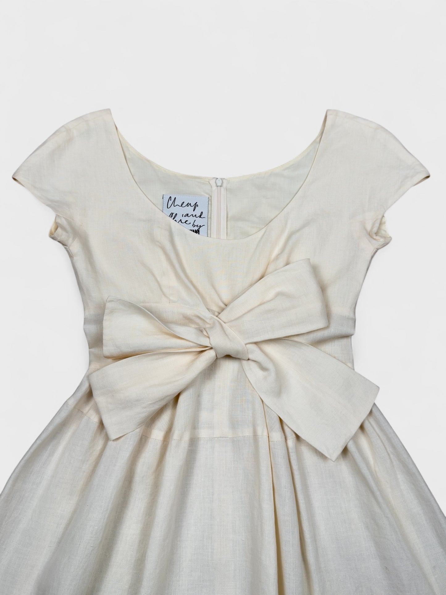 Moschino Cheap And Chic 1990s linen bow dress with front ribbon detail.