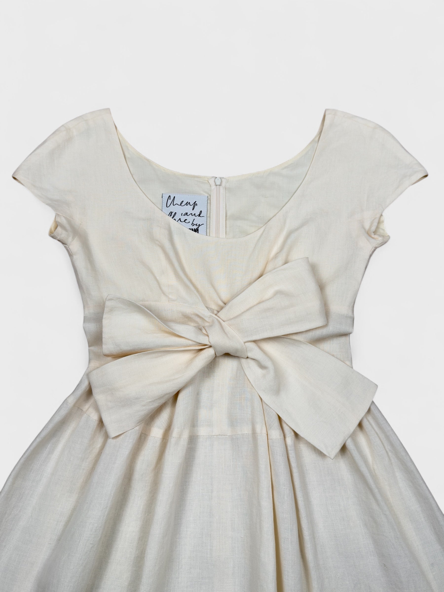 Moschino Cheap And Chic 1990s linen bow dress with front ribbon detail.