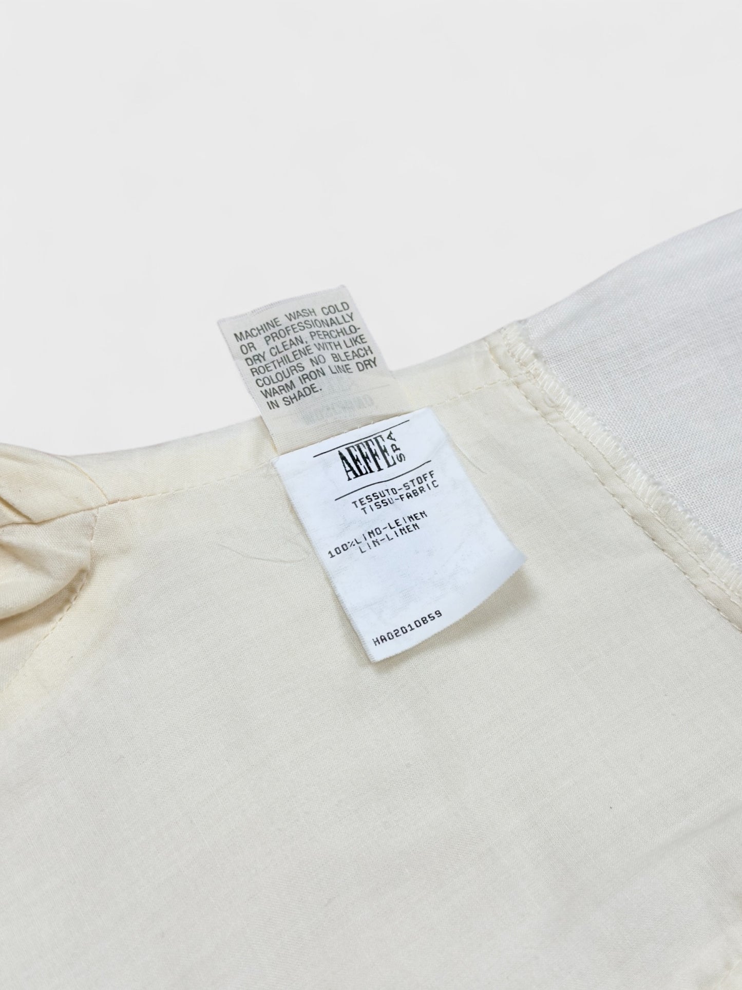 Moschino Cheap And Chic 1990s linen bow dress with front ribbon detail.