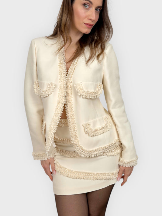 Moschino Cheap And Chic 1990s “Nature Friendly Garment” jacket and skirt set with ruffled inserts.